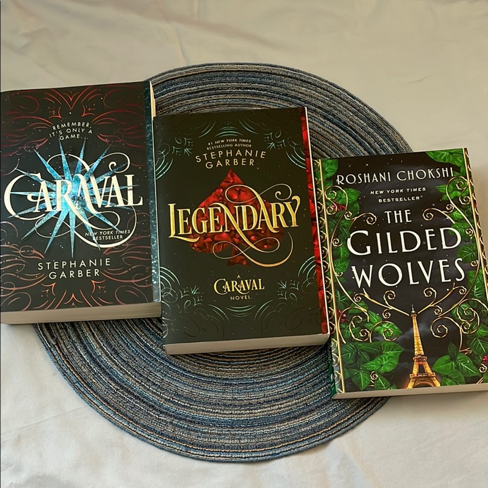 Three young adult fantasy fiction novels | Caraval series and The Gilded Wolves